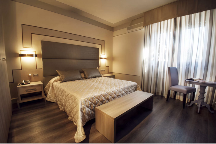 Buitenhof Reizen - Gardameer - begeleide vakanties voor mensen met een beperking - Conca d'Oro Hotel slaapkamer voorbeeld